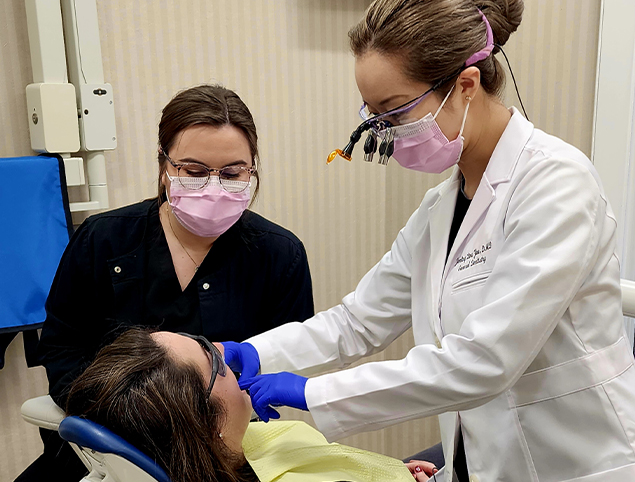 Topsham dentist and dental assistant treating a patient