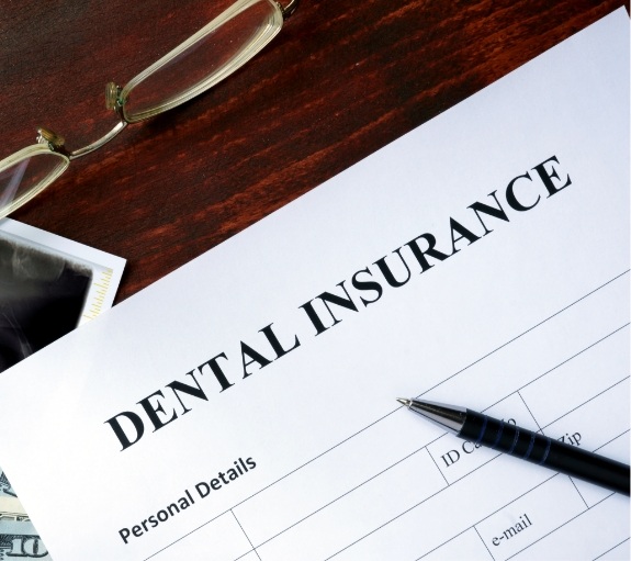 Dental insurance paperwork on desk