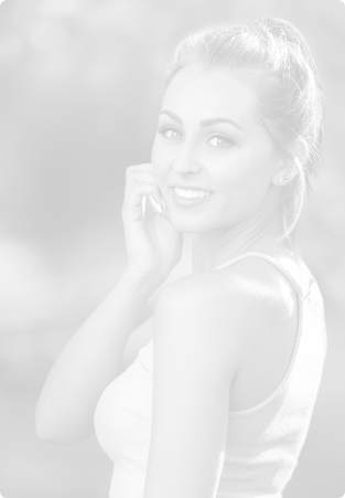 Smiling young woman in sleeveless white tanktop