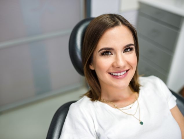 Smiling woman in dental chair in Topsham dental office