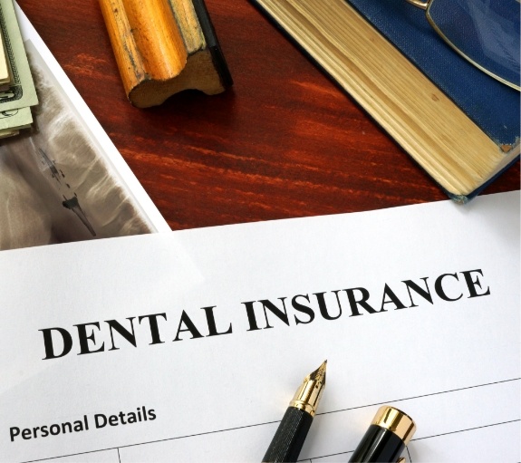 Dental insurance paperwork on desk