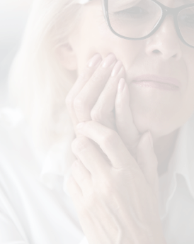 Close up of woman holding her cheek in pain